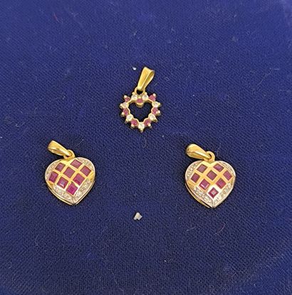 Three heart-shaped pendants, one pair in...