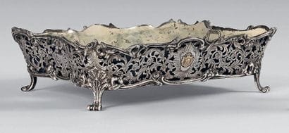 Four-lobed openwork silver planter on four...