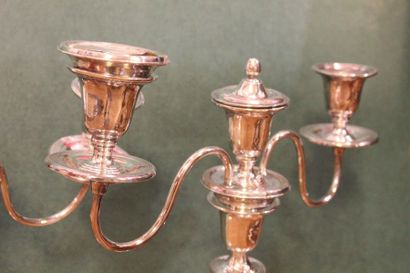 Pair of silver plated metal torches forming...