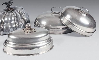 Three flat bells of oval shape in silver...