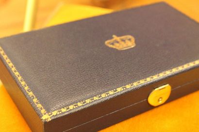 Small rectangular silver tray with a medal...