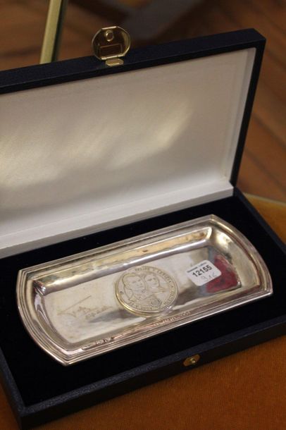 Small rectangular silver tray with a medal...