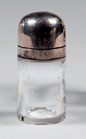 Small cylindrical glass bottle, the lid in...