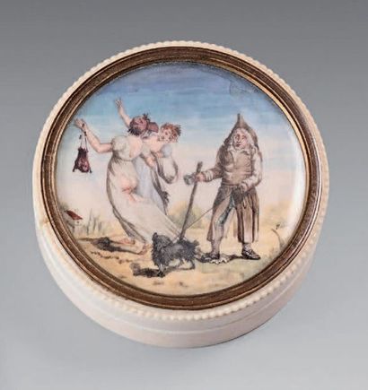 Round ivory box, the lid decorated with characters...
