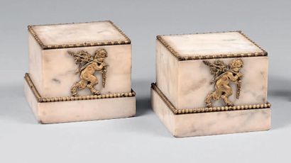 Pair of cubic white marble pedestals decorated...