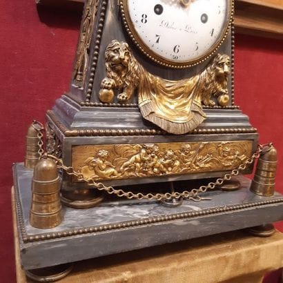 Large obelisk-shaped clock in turquoise blue...