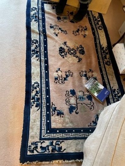 
Two Chinese carpets with beige background...