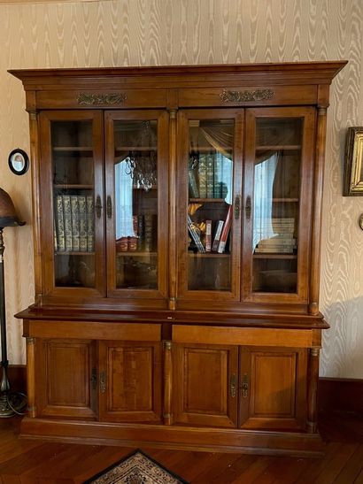 Mahogany bookcase, opening with four glass...