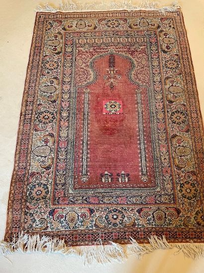 
Persian carpet decorated with a Mirhab,...