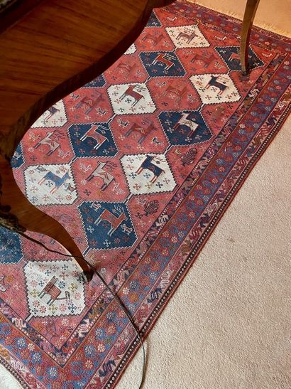 
Oriental carpet decorated with deer in medallions,...