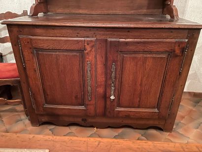 Moulded oak sideboard opening with two doors....