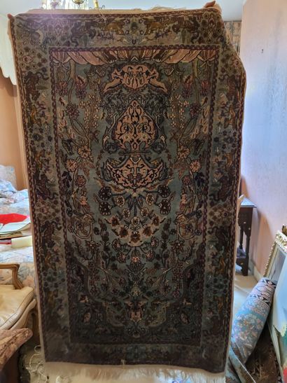 THREE ORIENTAL RUGS, two decorated with a...