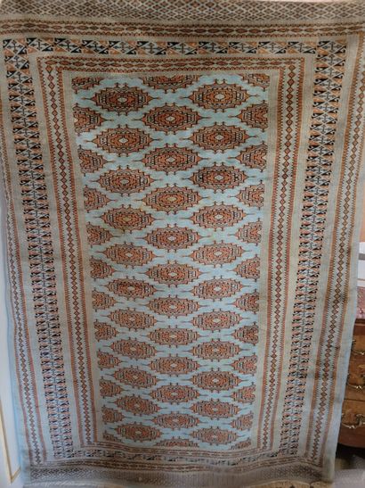 THREE ORIENTAL RUGS, two decorated with a...