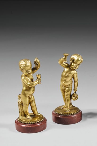 Pair of gilt bronze statuettes of young Bacchus....