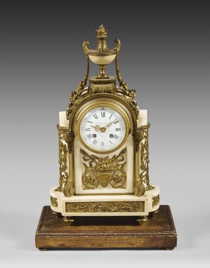 White marble and ormolu clock featuring a...