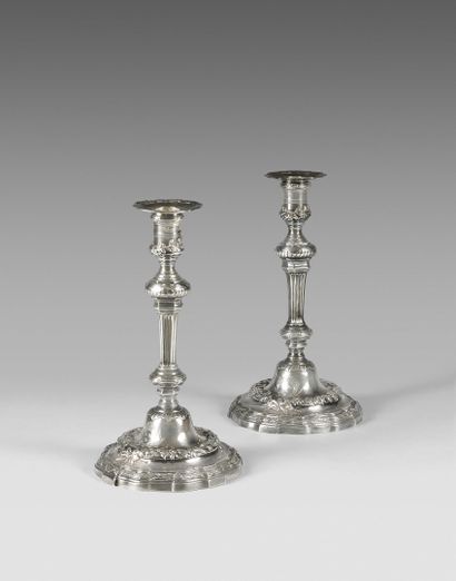 Pair of silver torches. Shaft with knot,...