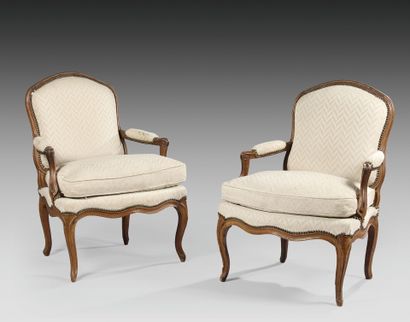Pair of flat-back armchairs in molded beech....