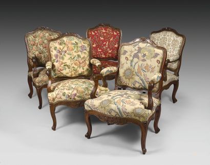 Five curved flat-back armchairs in molded...