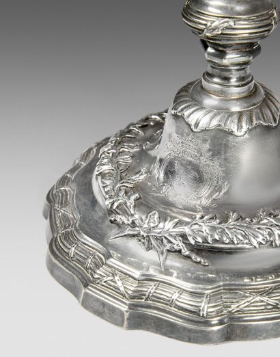 Pair of silver torches. Shaft with knot,...