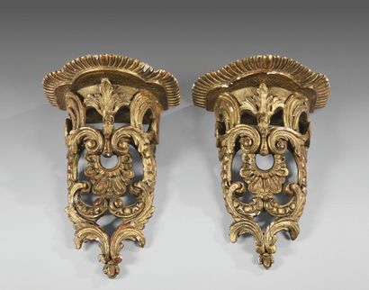 Pair of gilded wood sconces carved with foliate...