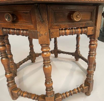 Octagonal walnut table opening with four...
