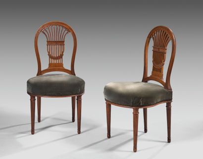 Pair of walnut chairs with openwork backs....