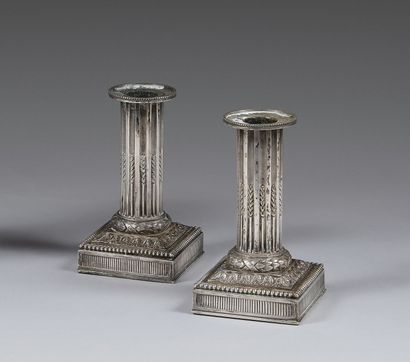 Pair of small silver-plated torches adorned...