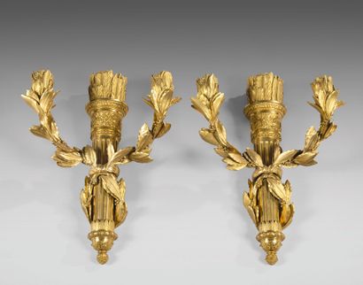 Pair of gilded bronze sconces with two laurel...