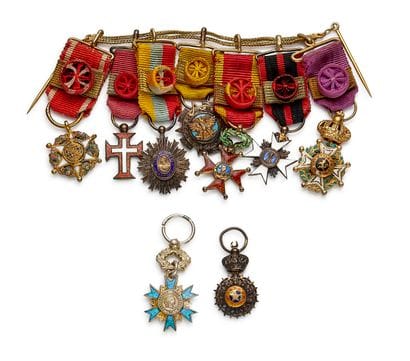 Set of nine miniatures: 
- A two-strand gold...