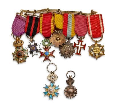 Set of nine miniatures: 
- A two-strand gold...