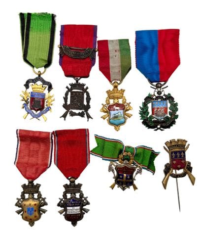 Set of eight shooting company medals or badges:...