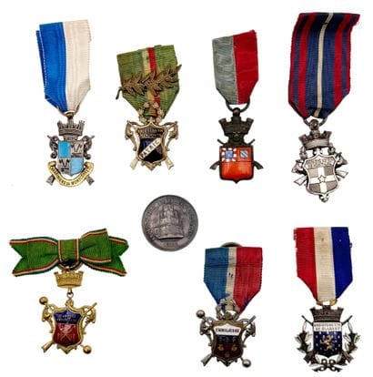 Set of eight shooting company medals or badges:...