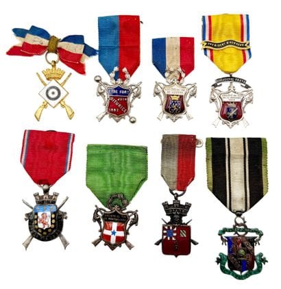 Set of eight shooting company medals or badges:...