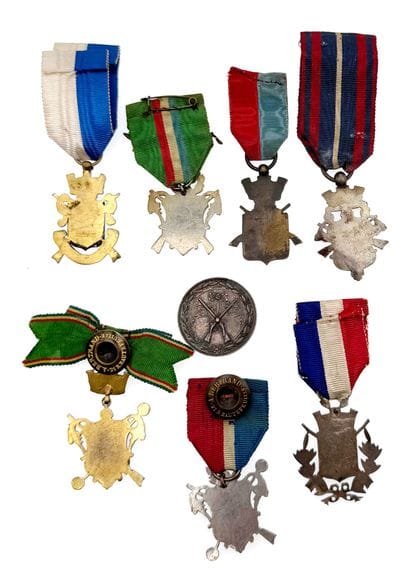 Set of eight shooting company medals or badges:...