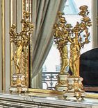 Paire de candélabres en bronze doré, le fût...