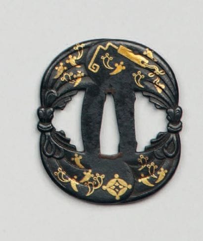 Tsuba en fer formée de deux sacs noués ensemble...