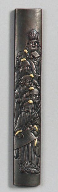 Kozuka en shakudo décoré en léger relief...