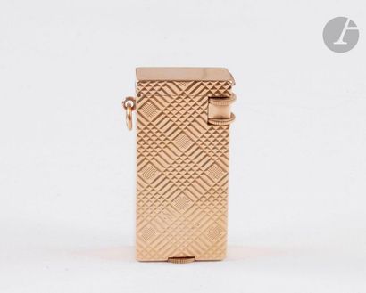 BOUCHERON Paris. Petrol lighter in yellow...
