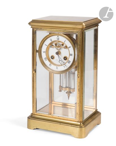 Pendule cage en laiton mouluré et doré et...