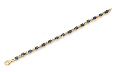 Bracelet en or 18K (750) articulé de saphirs...