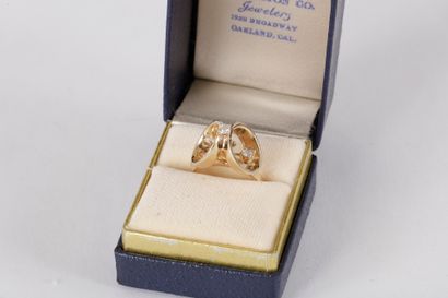 Bague en or 14K (585) ornée de 3 diamants...