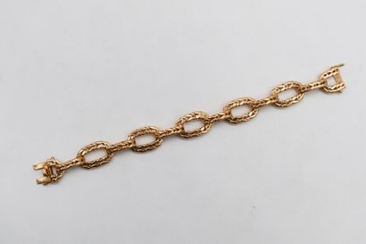 Bracelet articulé en or 18K (750) maillons...