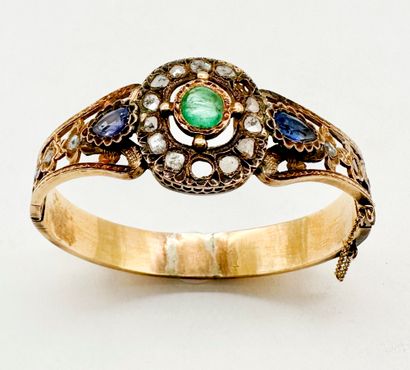 Bracelet ouvrant en or 18K (750) ajouré et...
