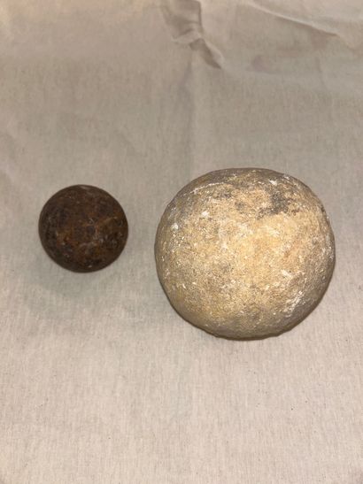 Set of eight iron and stone cannonballs of...