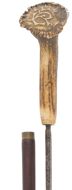 Canne-dague. 
Poignée en bois de cerf sculpté...