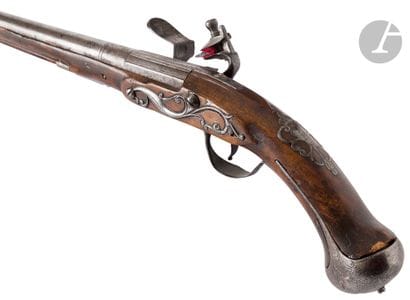 Long flintlock pommel gun. 
Round barrel...