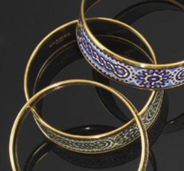 HERMES
Bracelet en métal doré, à décor de...