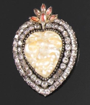 Pendentif cordiforme en argent, centrée d'une...