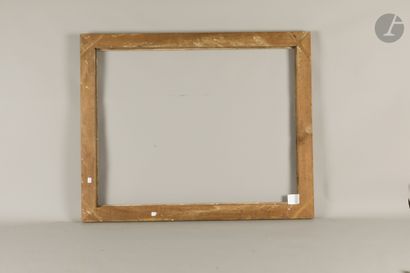 Grande baguette en bois sculpté et doré à...