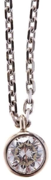 Pendentif en or gris, orné d'un diamant pesant...